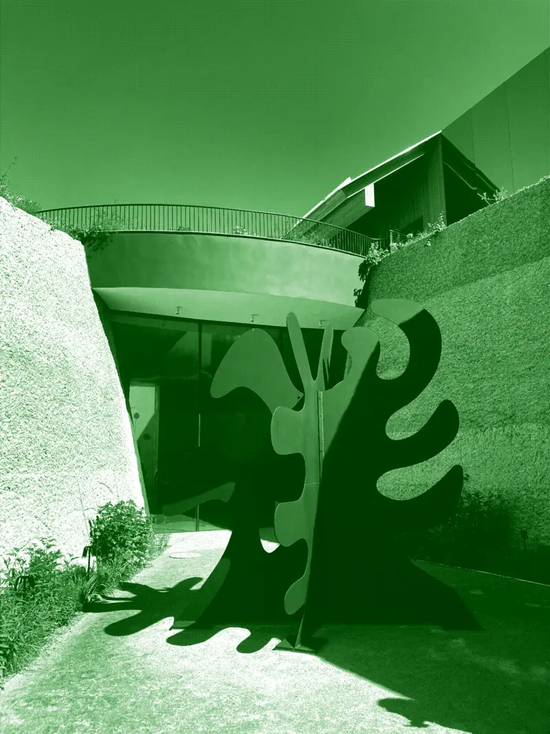 A stabile by Alexander Calder in a museum garden courtyard