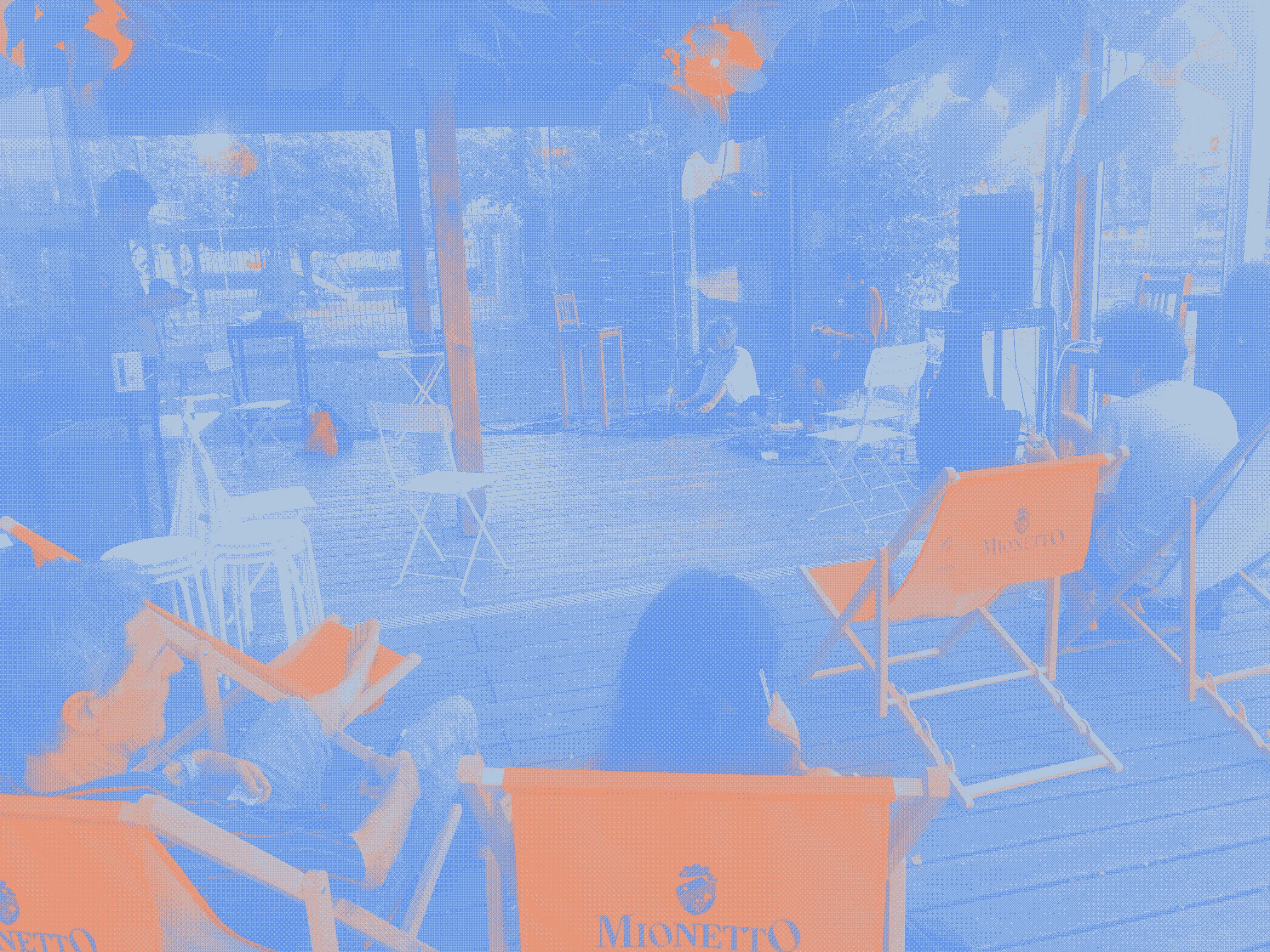 Musicians on the floor, loungers smoking all around