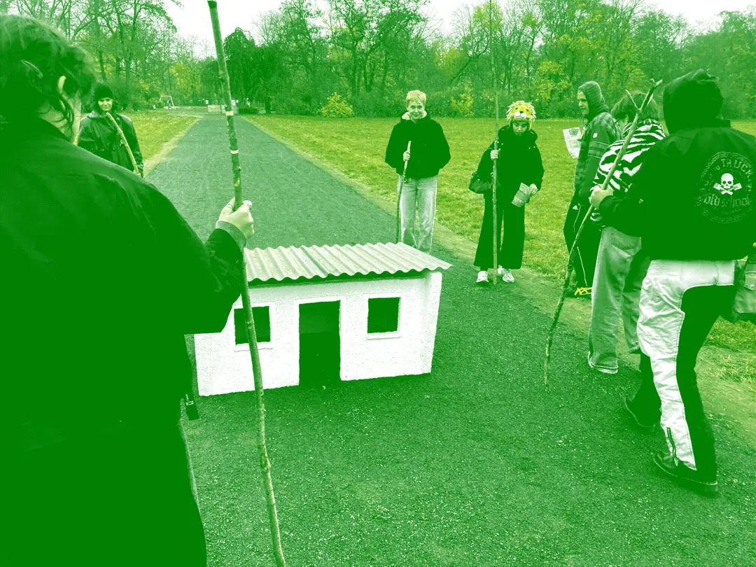 Hikers examining an artwork in the park