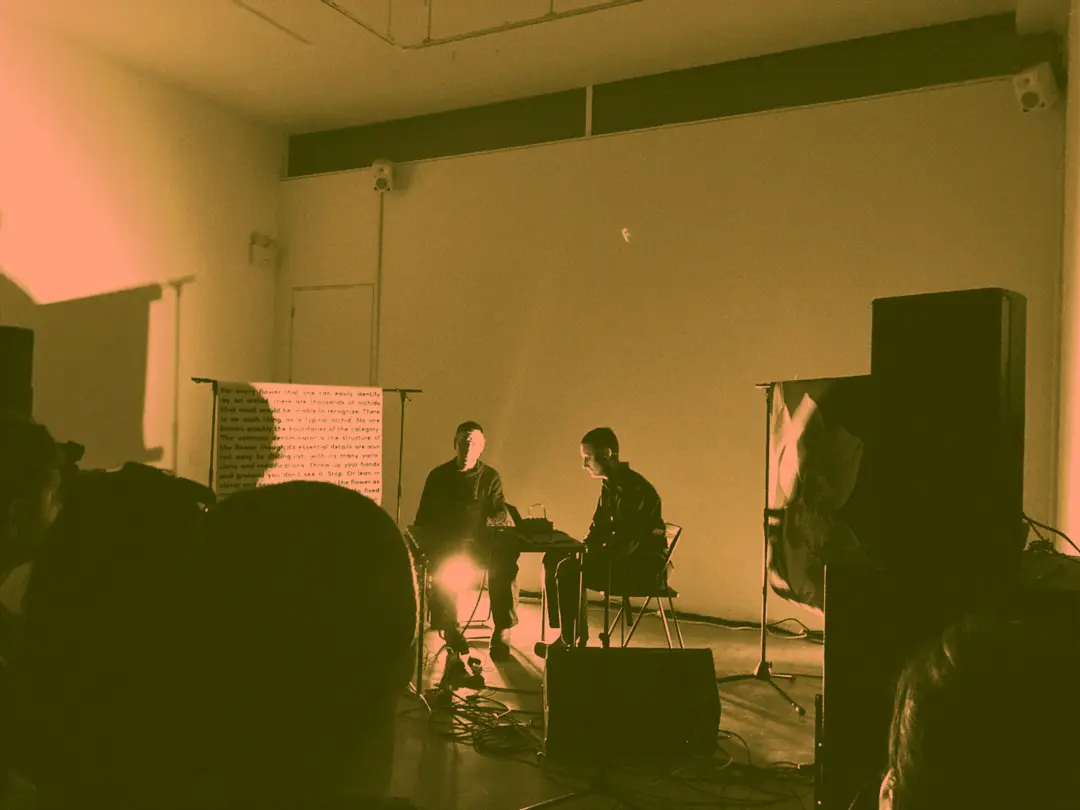 Lucky Dragons sitting at a table making noise music