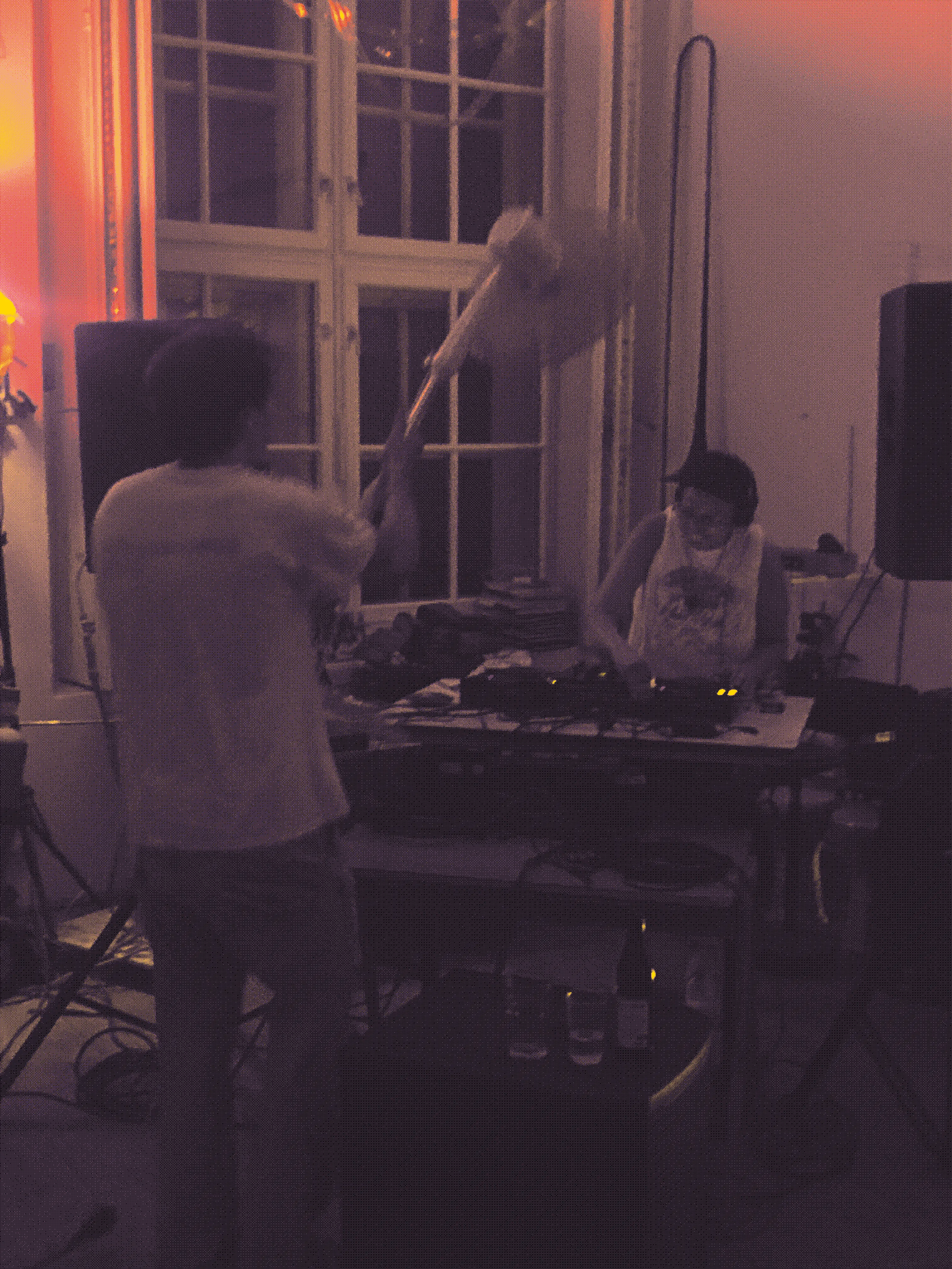A dancer holds the fan up to DJ Mtasa during her set