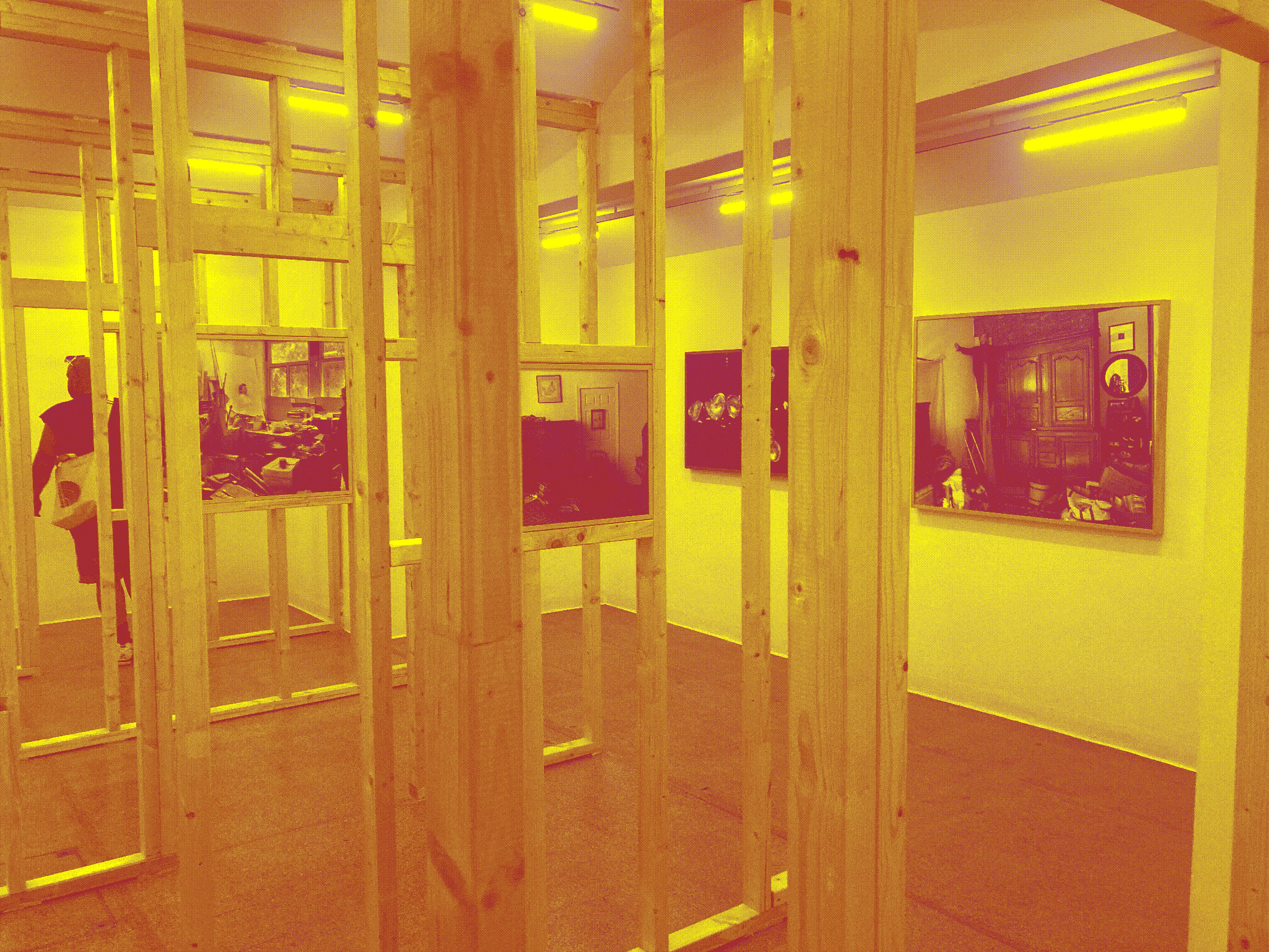 wooden construction with mounted photographs