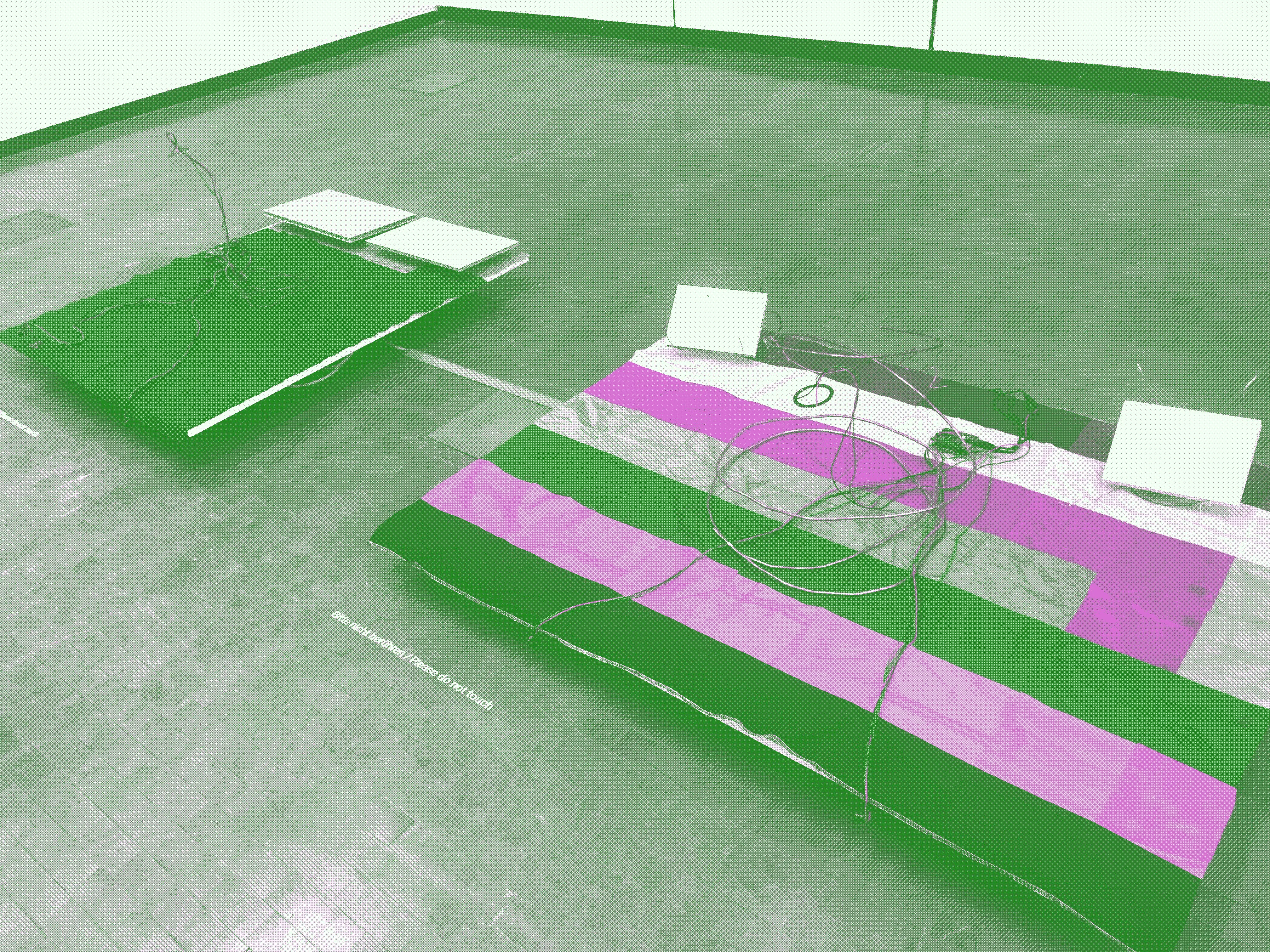 two sound installations of cables, arduino and electronics jankily placed atop two flag-like bases