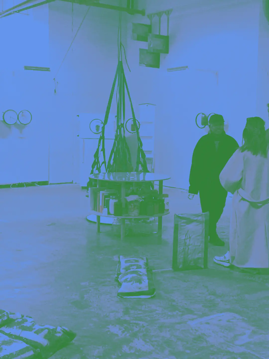 art installations in a gallery with random stuff on the floor and goopy mess art